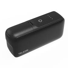 Black portable device with Telesin branding on a white background