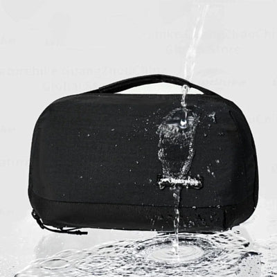 Black waterproof bag with water splashing out on a white background