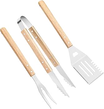 Set of four barbecue tools with wooden handles on a white background