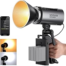 Studio light with remote control and smartphone app interface, held by a hand.