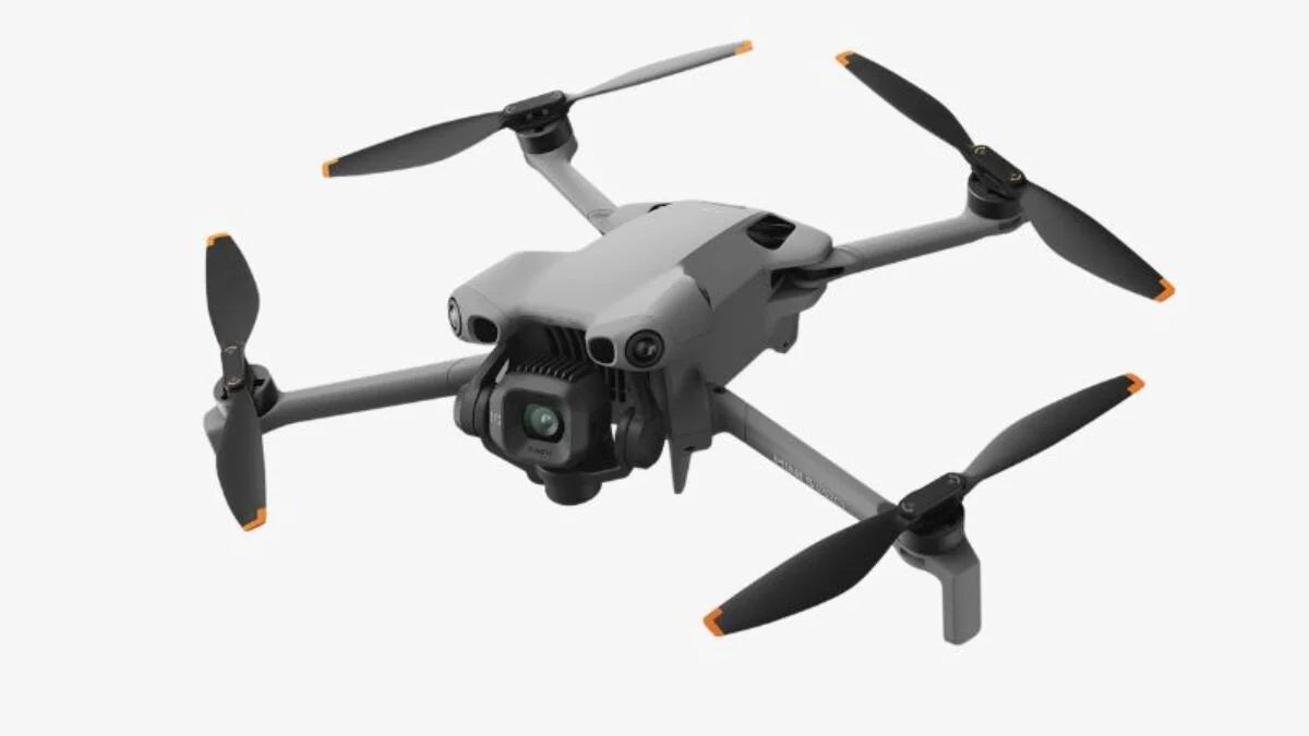 Gray drone with four propellers on a white background