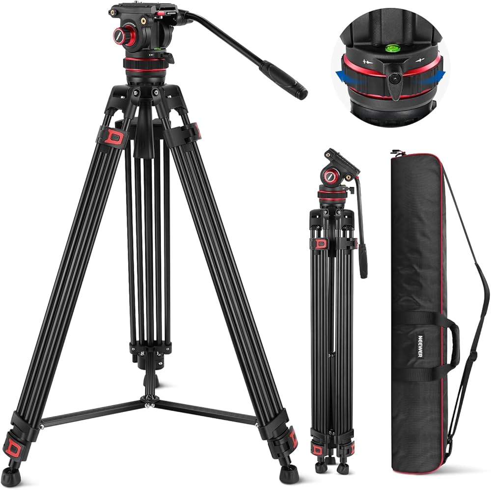 Camera tripod with head, additional head, and carrying case on a white background